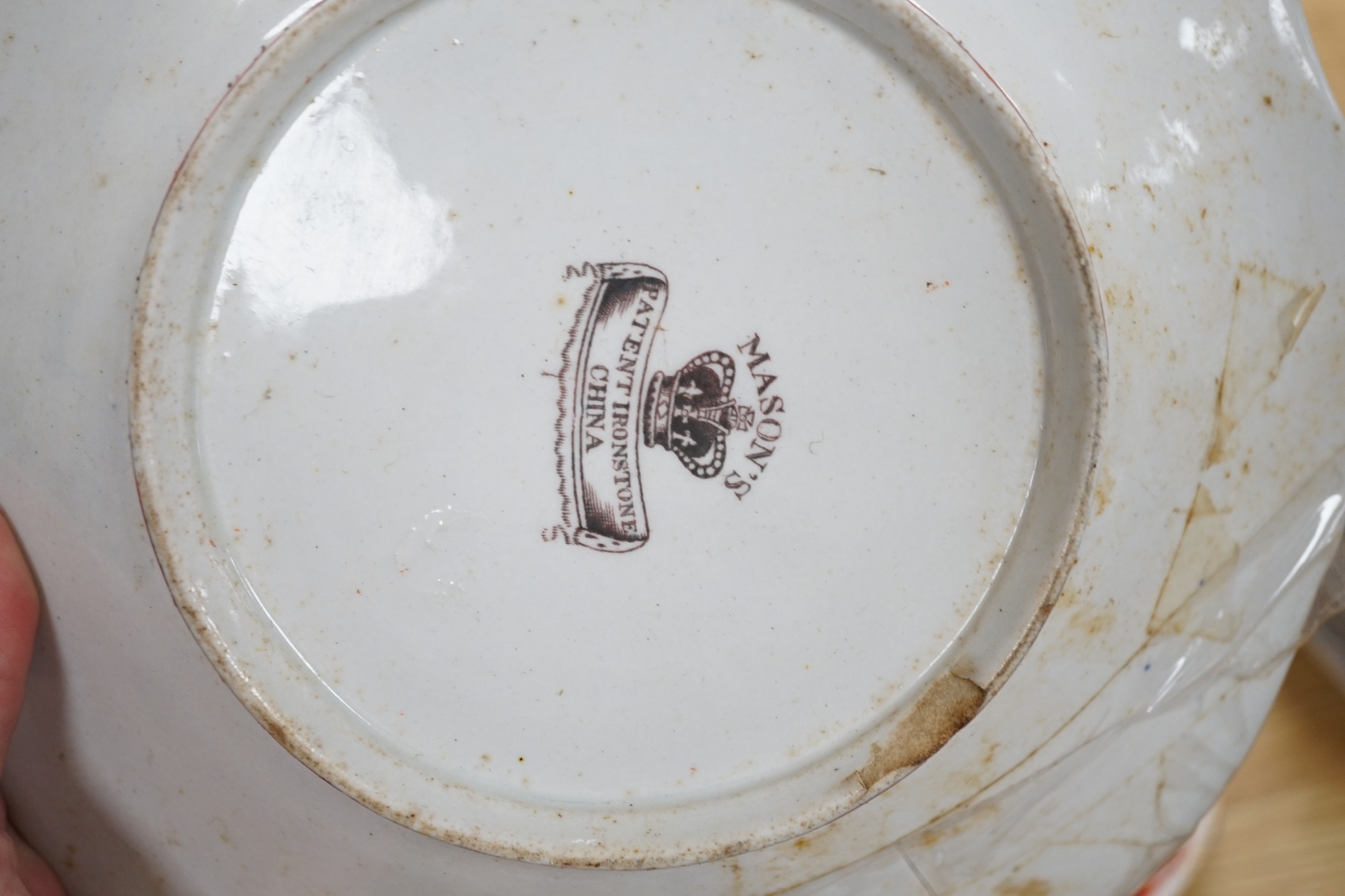 Seventeen ironstone items including two jardinières, a tureen and a quantity of plates, largest 28cm high. Condition - poor to fair